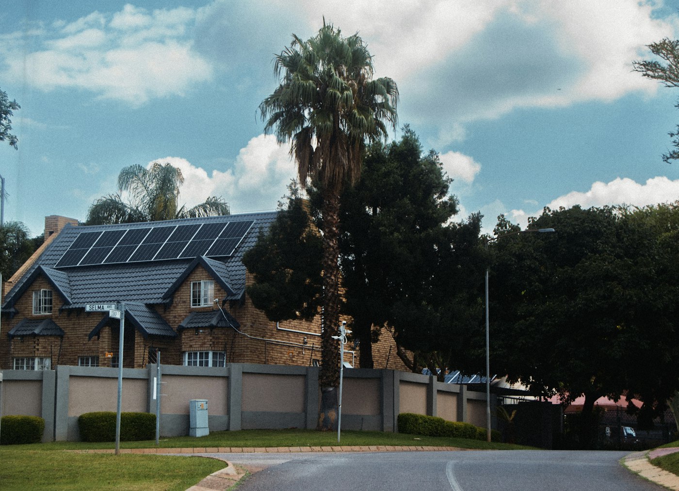 A modern home with solar panels on the roof